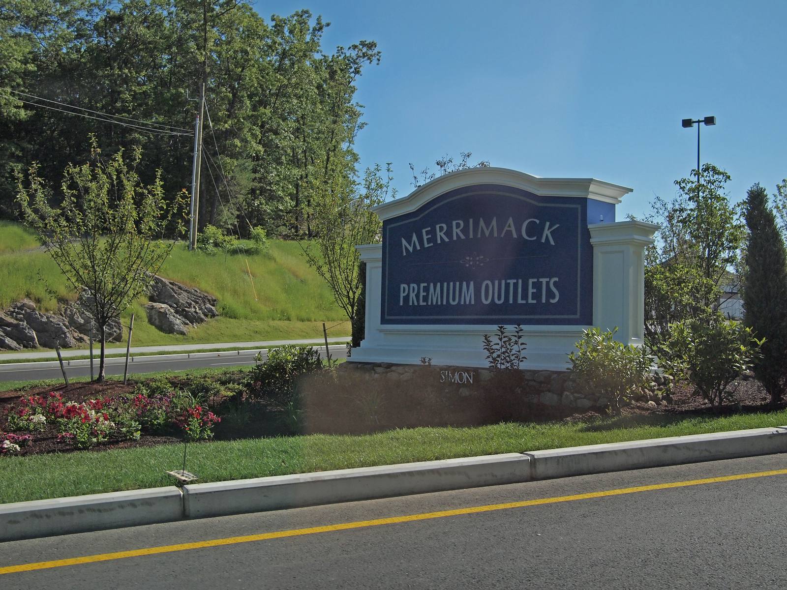 The main entrance of Merrimack Premium Outlets, with a sign over the doors